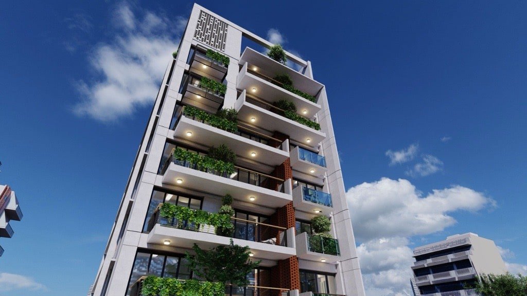 Close view of lit balconies and planters on the façade of Jolshiri Residence 01